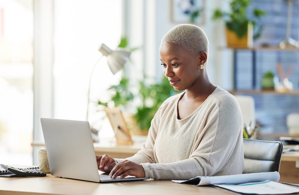 Woman working on her laptop.